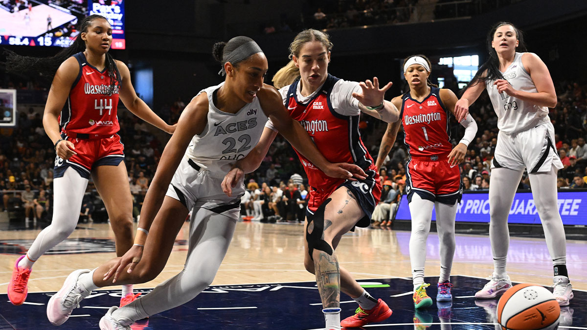 Las Vegas Aces center A'ja Wilson (22) and Washington Mystics forward Emily Engstler (21) battle for a loose ball during the first quarter at CareFirst Arena.