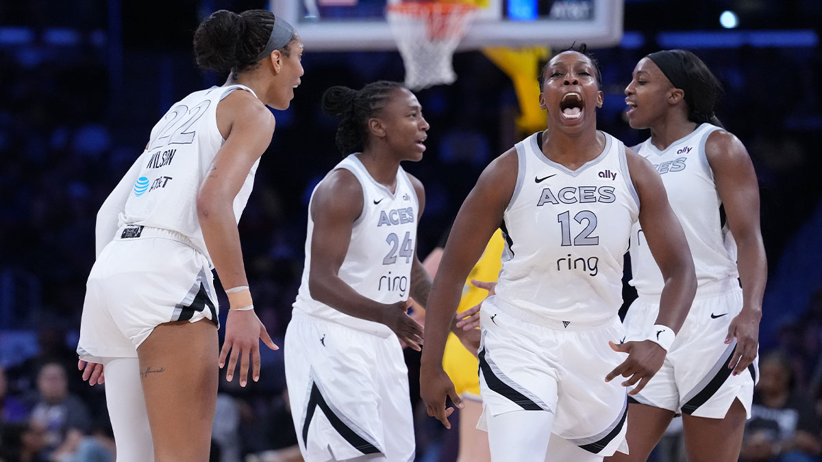 Las Vegas Aces center A'ja Wilson (22) and guard Chelsea Gray (12) celebrate in the first half against the LA Sparks at Crypto.com Arena.
