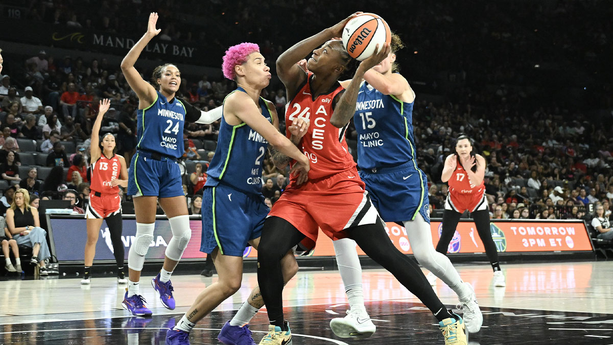 Las Vegas Aces guard Jewell Loyd (24) collides with Minnesota Lynx guard Natisha Hiedeman (2) during the third quarter of their game at Michelob Ultra Arena.