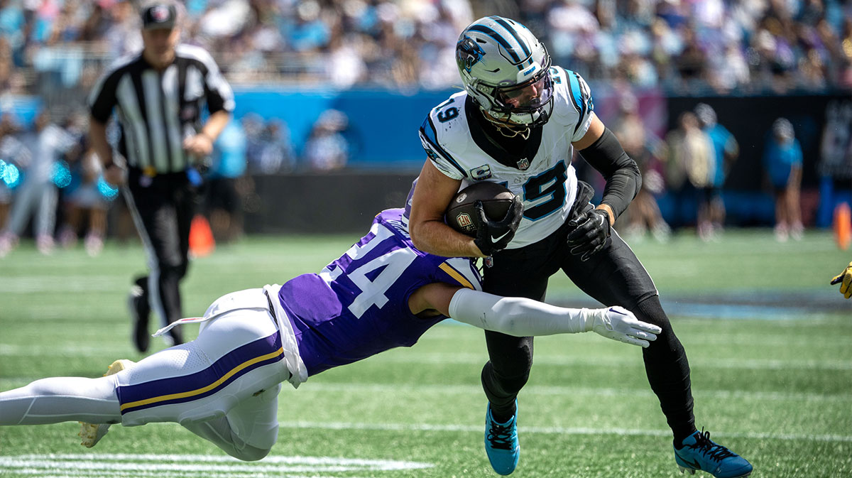 Carolina Panthers wide receiver Adam Thielen (19) with the ball as Minnesota Vikings safety Camryn Bynum (24) defends in the second quarter at Bank of America Stadium.