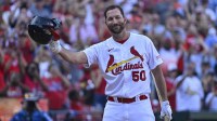 St. Louis Cardinals pinch hitter Adam Wainwright (50) tips his cap as he receives a standing ovation before his final at bat during the eighth inning against the Cincinnati Reds at Busch Stadium.