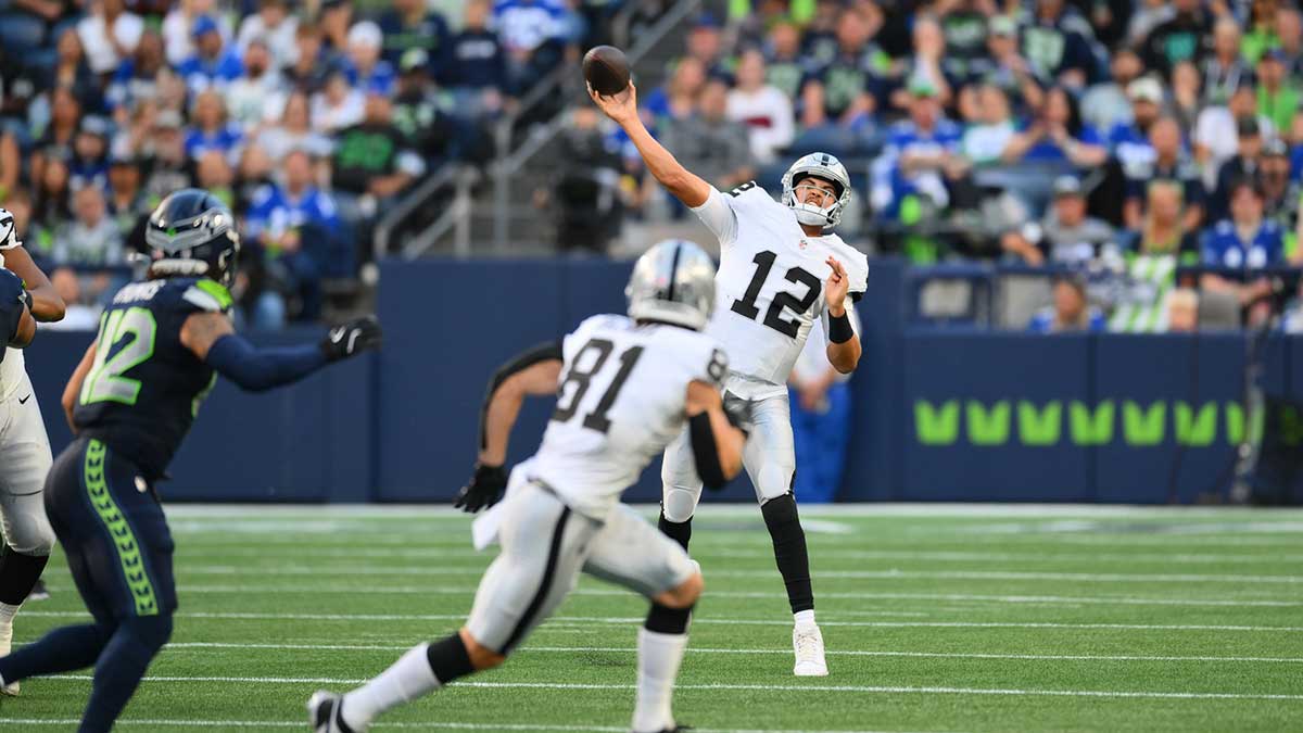 Aug 7, 2025; Seattle, Washington, USA; Las Vegas Raiders quarterback Aidan O'Connell (12) passes the ball against the Seattle Seahawks during the first half at Lumen Field. 