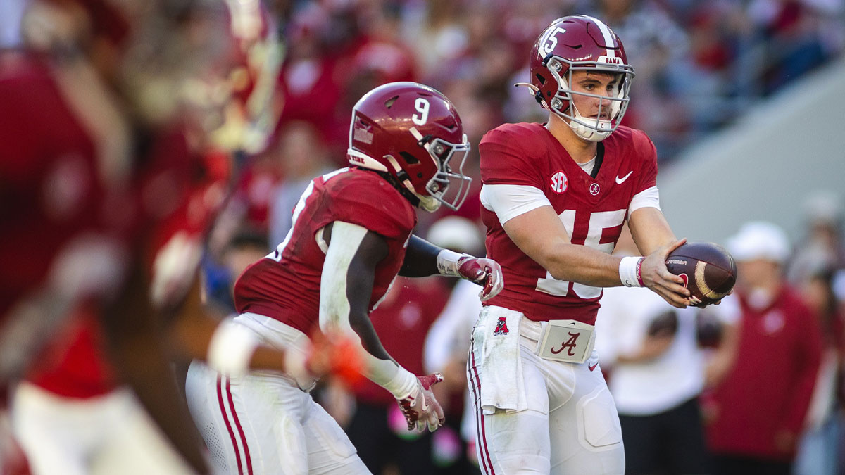 Alabama Crimson Tide quarterback Ty Simpson (15) goes to pass off against the Mercer Bears during the fourth quarter at Bryant-Denny Stadium.
