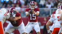 Alabama Crimson Tide quarterback Ty Simpson (15) receives a snapped ball against the Mercer Bears during the third quarter at Bryant-Denny Stadium.