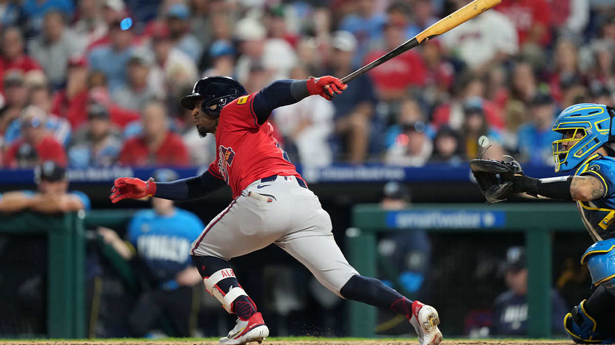 Atlanta Braves infielder Ozzie Albies (1) hits a single against the Philadelphia Phillies in the fifth inning at Citizens Bank Park.