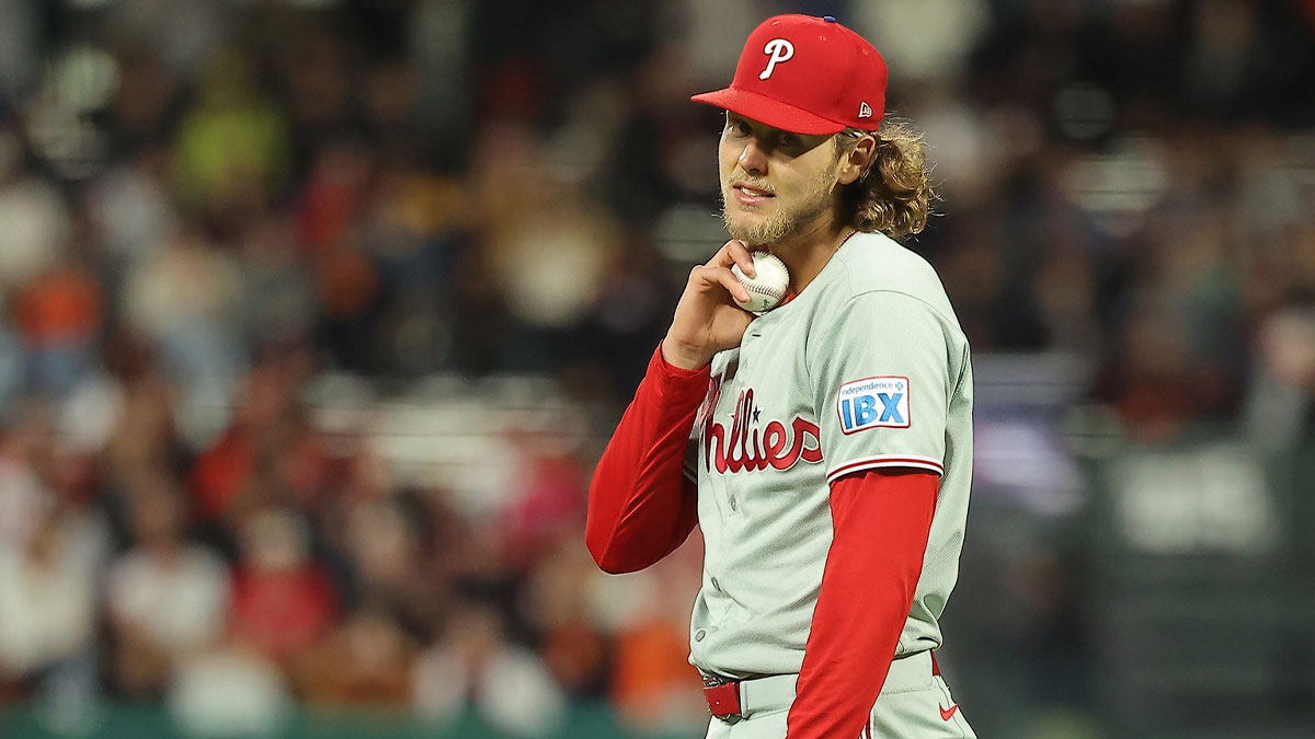 Philadelphia Phillies third baseman Alec Bohm (28) checks his pulse after bobbling the ball against the San Francisco Giants during the ninth inning at Oracle Park.