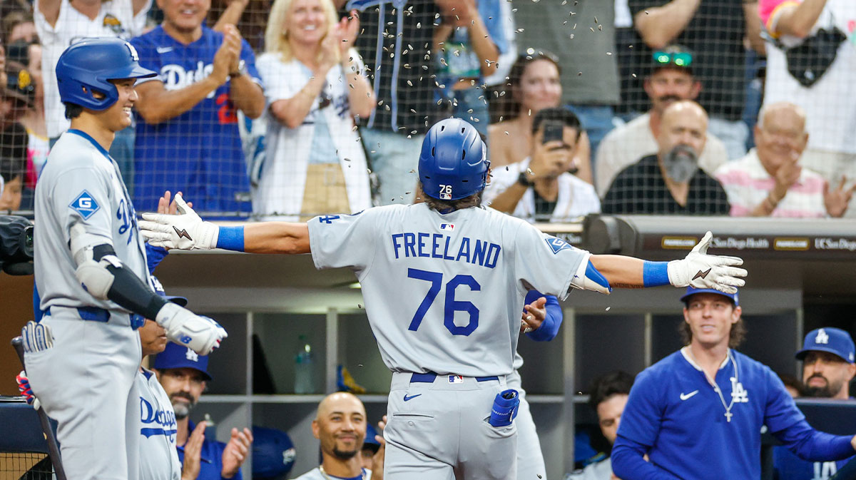 Los Angeles Dodgers second baseman Alex Freeland (76) celebrates with the dugout after hitting a solo home run during the third inning against the San Diego Padres at Petco Park.