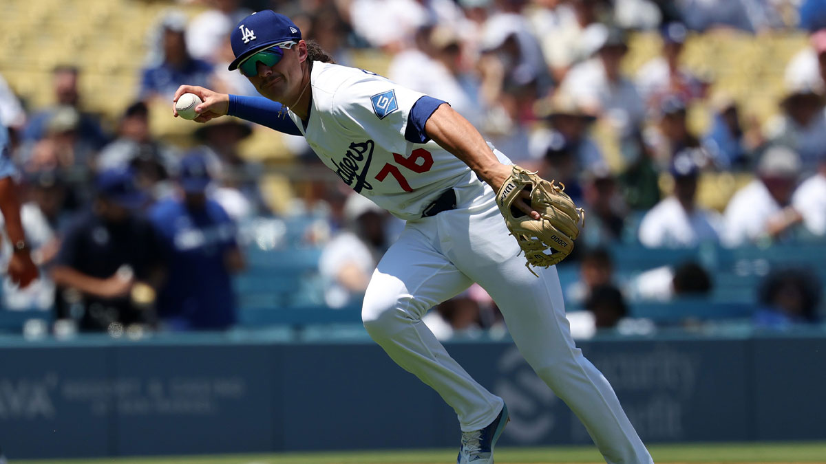 Los Angeles Dodgers third baseman Alex Freeland (76) fields a bunt RBI single by St. Louis Cardinals second baseman Brendan Donovan (33, not pictured) during the third inning at Dodger Stadium.
