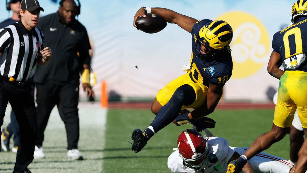 Alabama Crimson Tide defensive back Domani Jackson (1) tackles Michigan Wolverines quarterback Alex Orji (10) during the second half at Raymond James Stadium.