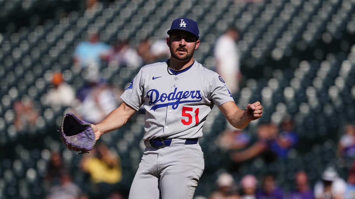 Los Angeles Dodgers relief pitcher Alex Vesia (51) reacts to the final out of the ninth inning against the Colorado Rockies at Coors Field.