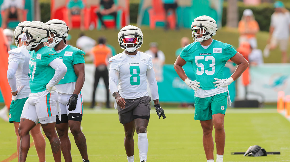 Miami Dolphins running back Alexander Mattison (8) and linebacker Cameron Goode (53) look on during training camp at Baptist Health Training Complex.