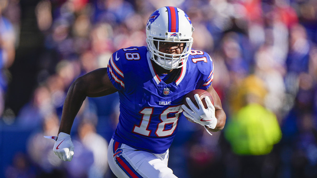 Buffalo Bills wide receiver Amari Cooper (18) runs with the ball after making a catch against the Tennessee Titans during the second half at Highmark Stadium.