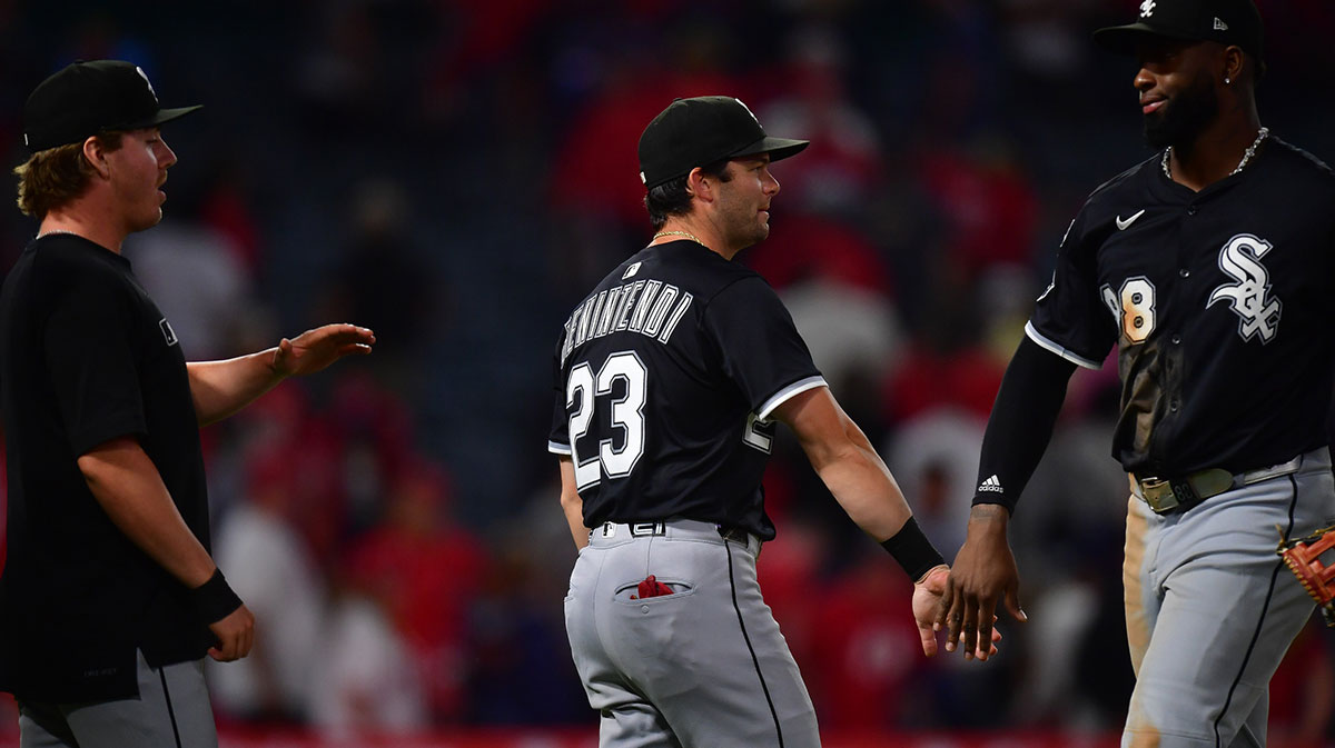Chicago White Sox designated hitter Andrew Benintendi (23) and center fielder Luis Robert Jr. (88) celebrate the victory against the Los Angeles Angels at Angel Stadium.