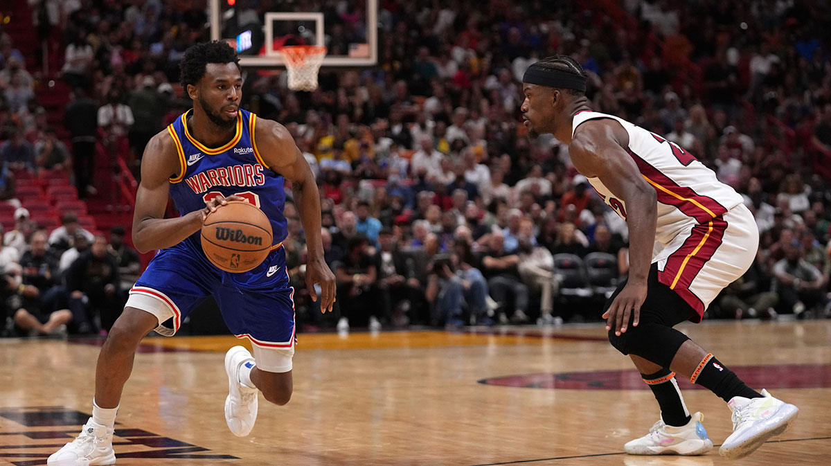 Golden State Warriors forward Andrew Wiggins (22) drives the ball around Miami Heat forward Jimmy Butler (22) during the second half at FTX Arena.