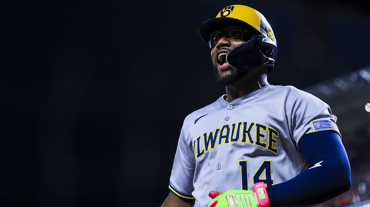 Milwaukee Brewers pinch hitter Andruw Monasterio (14) reacts after hitting a three-run home run in the eleventh inning against the Cincinnati Reds at Great American Ball Park.