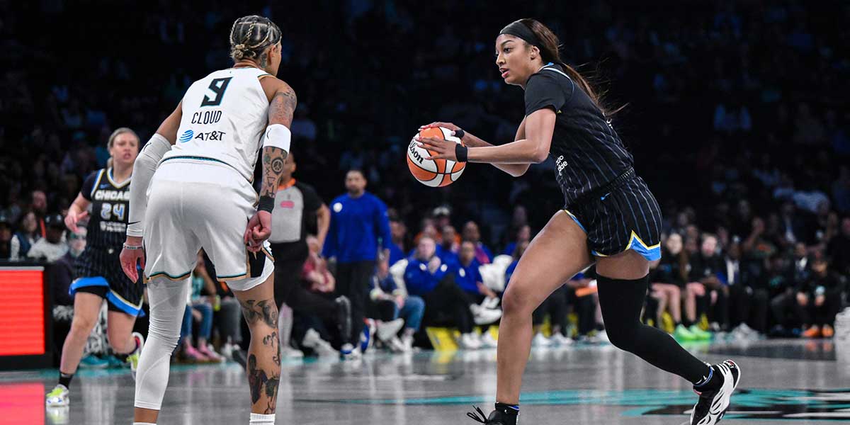 Chicago Sky forward Angel Reese (5) drives to the basket while defended by New York Liberty guard Natasha Cloud (9) during the first half at Barclays Center.