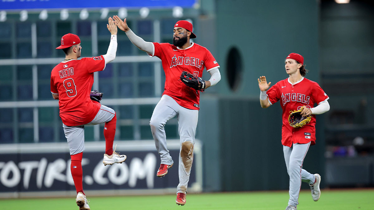 Los Angeles Angels shortstop Zach Neto (9) is congratulated by Los Angeles Angels center fielder Jo Adell (7) after the final out against the Houston Astros during the ninth inning at Daikin Park.