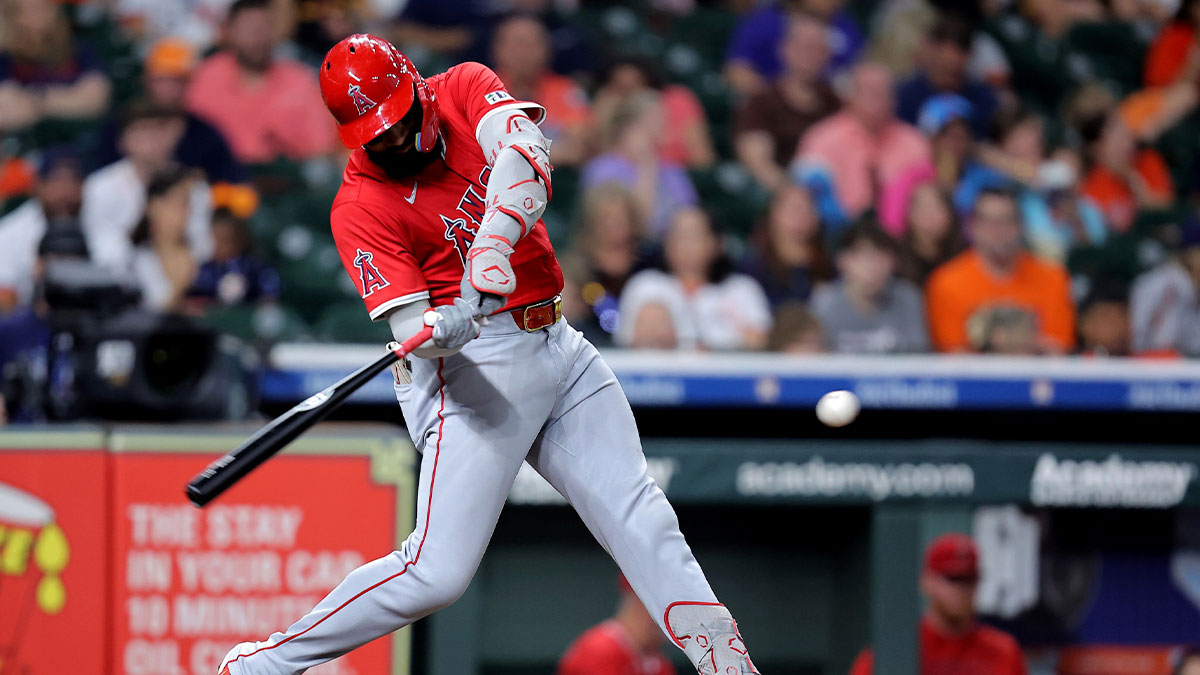 Los Angeles Angels center fielder Jo Adell (7) hits a single against the Houston Astros during the sixth inning at Daikin Park.