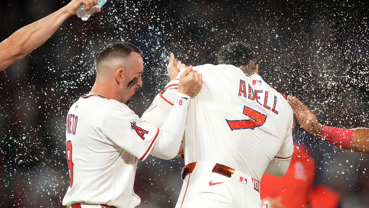 Los Angeles Angels right fielder Jo Adell (7) celebrates with shortstop Zach Neto (9) after hitting a walk-off single in the 10th inning against the Los Angeles Dodgers at Angel Stadium.