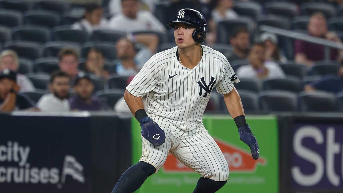 New York Yankees shortstop Anthony Volpe (11) takes a lead during the seventh inning against the Minnesota Twins at Yankee Stadium.