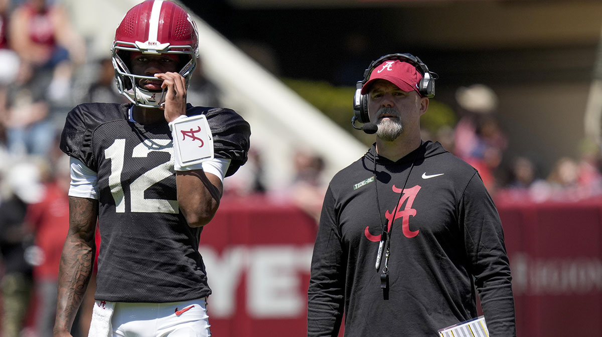 Alabama quarterback Keelon Russell (12) stands with Alabama offensive coordinator Ryan Grubb during A-Day drills at Bryant-Denny Stadium.