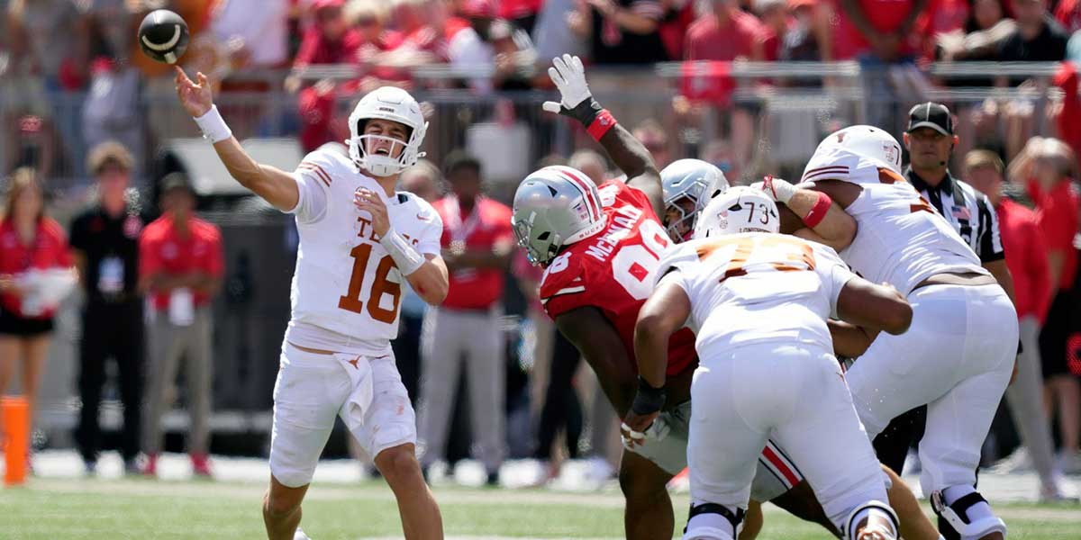 Texas Longhorns quarterback Arch Manning (16) throws an interception to Ohio State Buckeyes cornerback Jermaine Mathews Jr. (7) in the third quarter at Ohio Stadium.