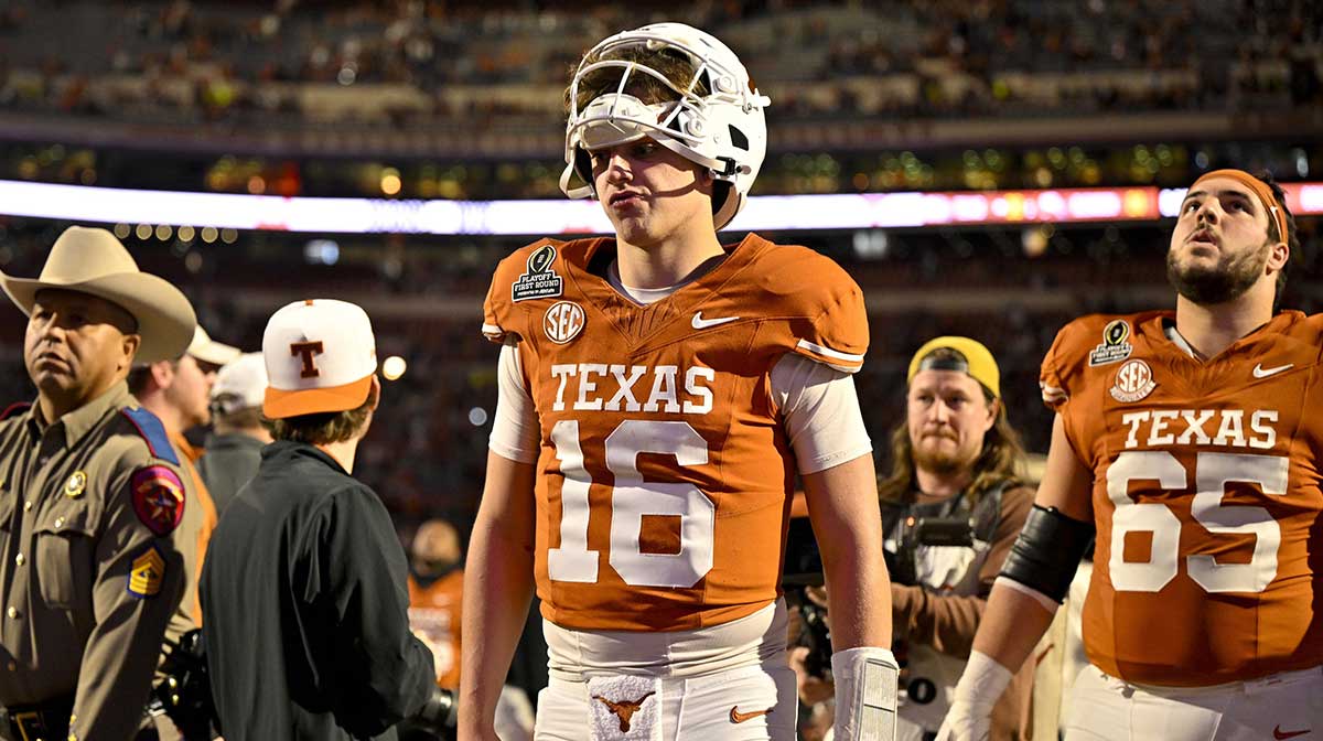 Texas Longhorns quarterback Arch Manning (16) walks off the field after UT defeats the Clemson Tigers in the CFP National Playoff first round game at Darrell K Royal-Texas Memorial Stadium.