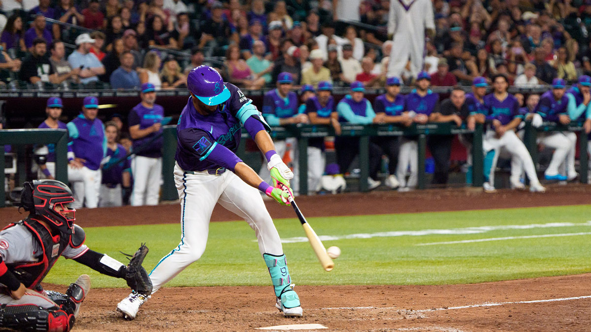 Arizona Diamondbacks outfielder Lourdes Gurriel Jr. (12) reacts after hitting the game winning RBI to score outfielder Corbin Carroll (7) (not shown) in the eleventh inning against the Cincinnati Reds at Chase Field. The Diamondback beat the Reds 6-5.