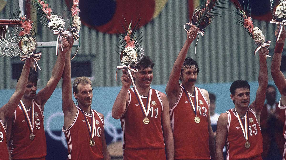 (left to right) Igors Miglinieks, Valery Tikhonenko, Rimas Kurtinaitis, Arvydas Sabonis, Viktor Pankrashkin and Valdemaras Chomicius of the Soviet Union wave to the crowd after receiving their medals for winning the men's basketball tournament at the 1988 Seoul Olympic Games at Jamsil Gymnasium.
