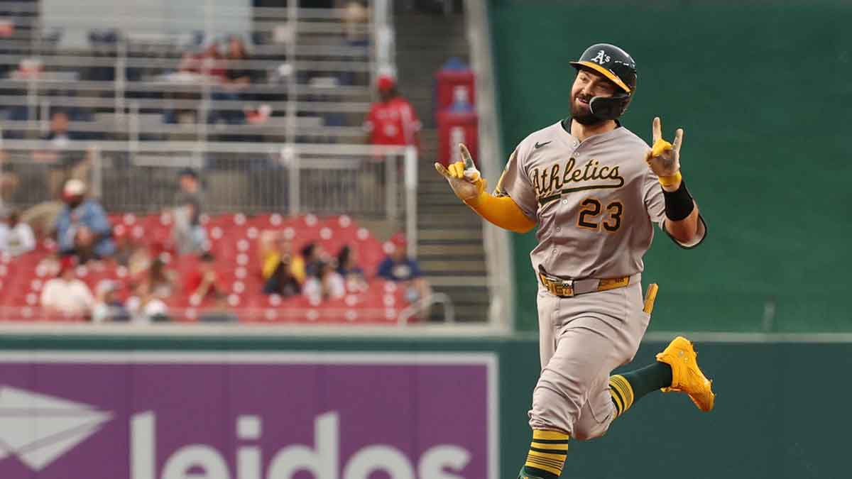 Athletics catcher Shea Langeliers (23) gestures to his dugout while rounding the bases after hitting a leadoff home run against the Washington Nationals during the first inning at Nationals Park.