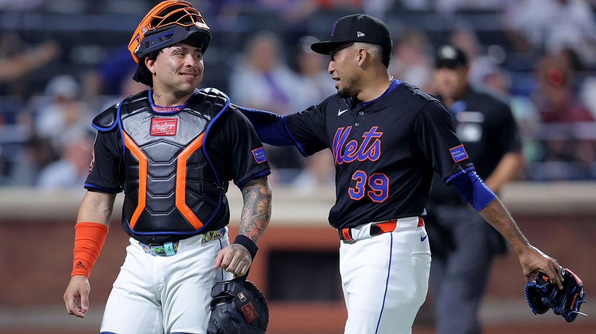 New York Mets catcher Francisco Alvarez (4) and relief pitcher Edwin Diaz (39) walk off the field after the top of the ninth inning against the Atlanta Braves at Citi Field.