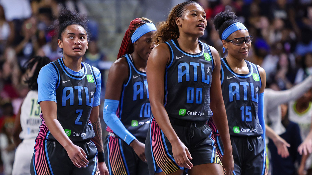 Atlanta Dream guard Te-Hina Paopao (2) and guard Rhyne Howard (10) and forward Naz Hillmon (00) and guard Allisha Gray (15) walks off the court against the Dallas Wings in the second quarter at Gateway Center Arena at College Park.