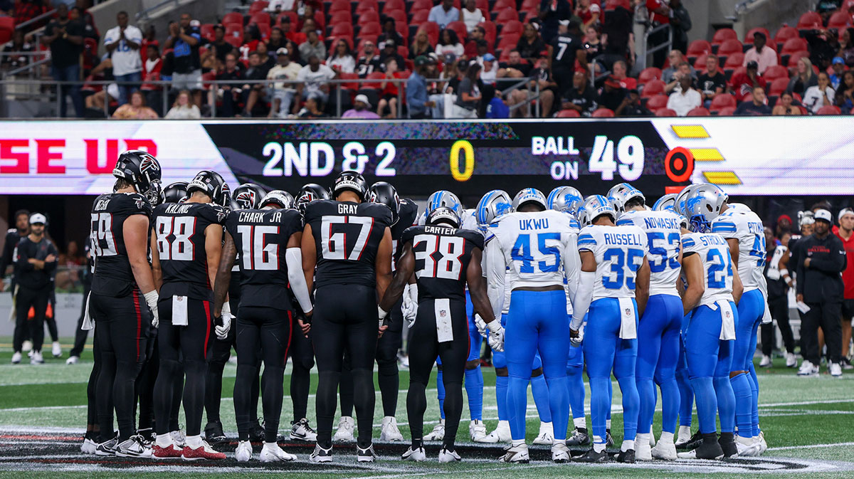 Aug 8, 2025; Atlanta, Georgia, USA; Atlanta Falcons and Detroit Lions players pray after an injury to safety Morice Norris (not pictured) in the fourth quarter at Mercedes-Benz Stadium. Mandatory Credit: Brett Davis-Imagn Images