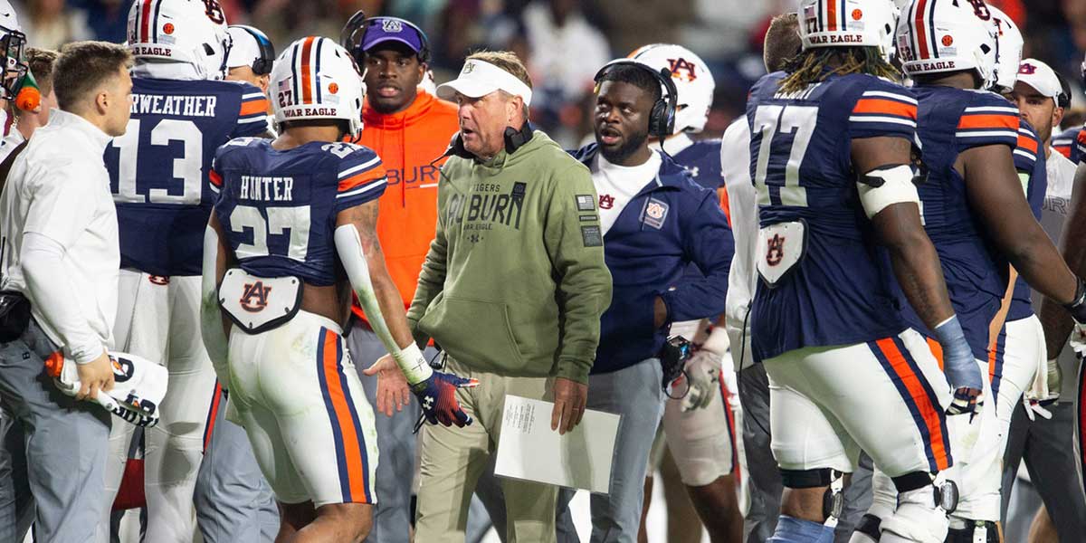 Auburn Tigers head coach Hugh Freeze huddles with his team during a timeout as Auburn Tigers take on Texas A&M Aggies at Jordan-Hare Stadium in Auburn, Ala., on Saturday, Sept. 7, 2024. Auburn Tigers lead Texas A&M Aggies 21-7 at halftime.
