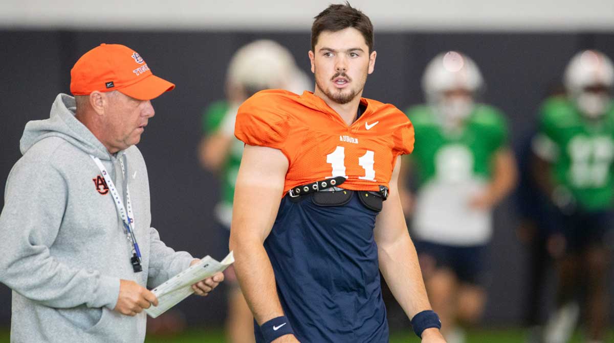 Auburn Tigers head coach Hugh Freeze talks with quarterback Jackson Arnold (11) during practice at Woltosz Football Performance Center in Auburn, Ala. on Tuesday, Aug. 26, 2025.