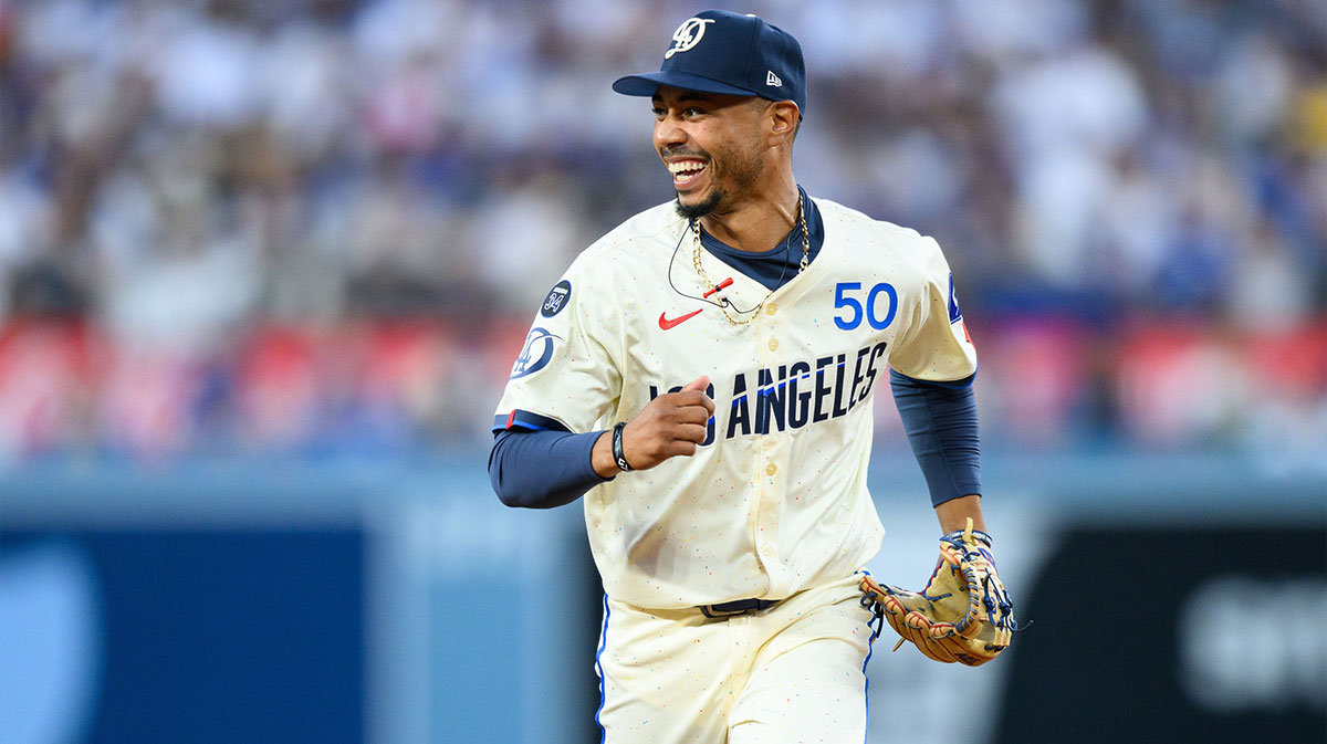 Los Angeles Dodgers shortstop Mookie Betts (50) reacts after making a catch during the fifth inning against the San Diego Padres at Dodger Stadium. Mandatory Credit: William Liang-Imagn Images