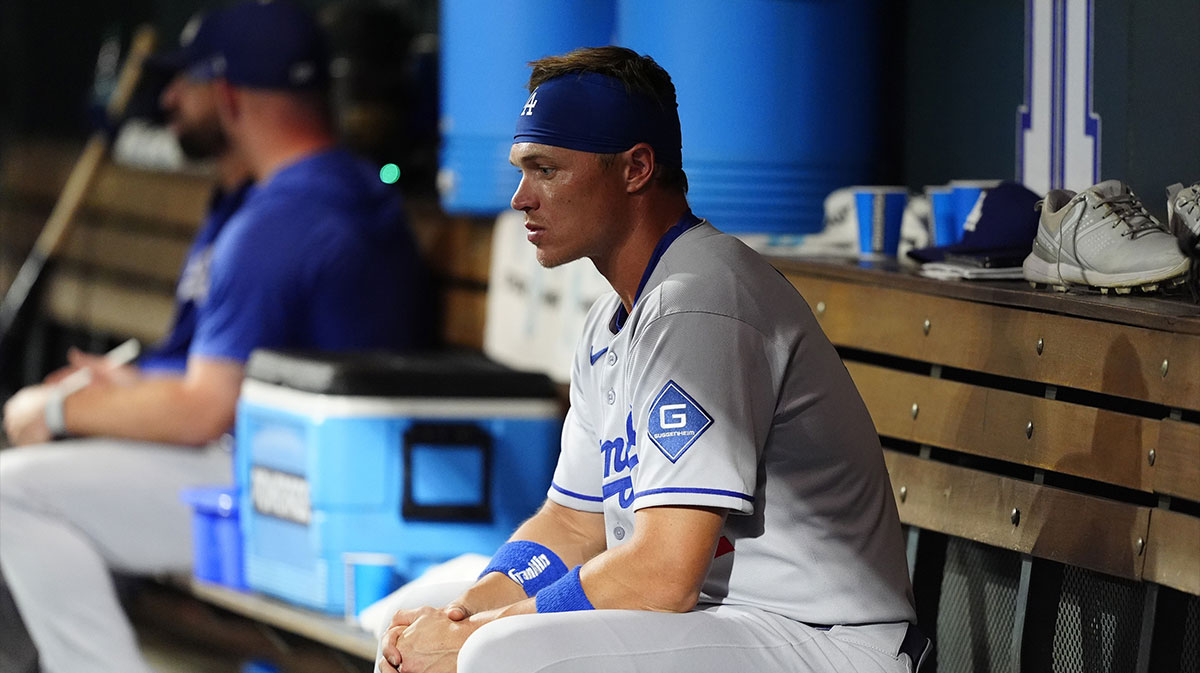 Los Angeles Dodgers outfielder Alex Call (12) on the bench in the eighth inning against the Colorado Rockies at Coors Field. Mandatory Credit: Ron Chenoy-Imagn Images