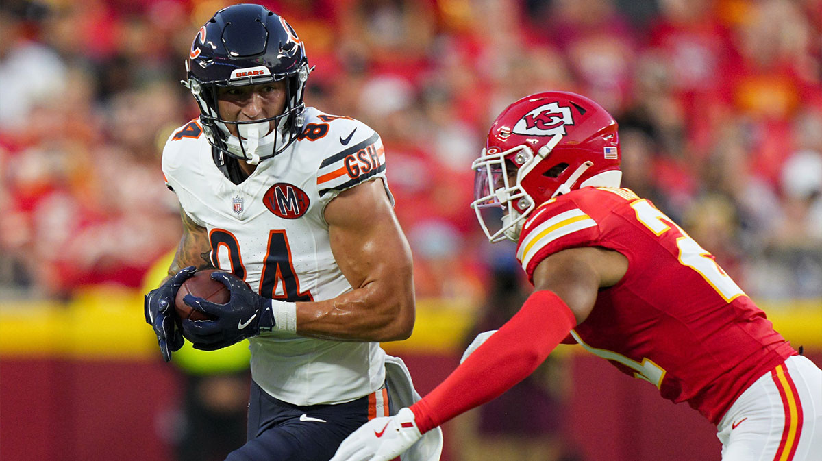 Chicago Bears tight end Colston Loveland (84) runs with the ball against Kansas City Chiefs safety Jaden Hicks (21) during the first half at GEHA Field at Arrowhead Stadium. Mandatory Credit: Jay Biggerstaff-Imagn Images