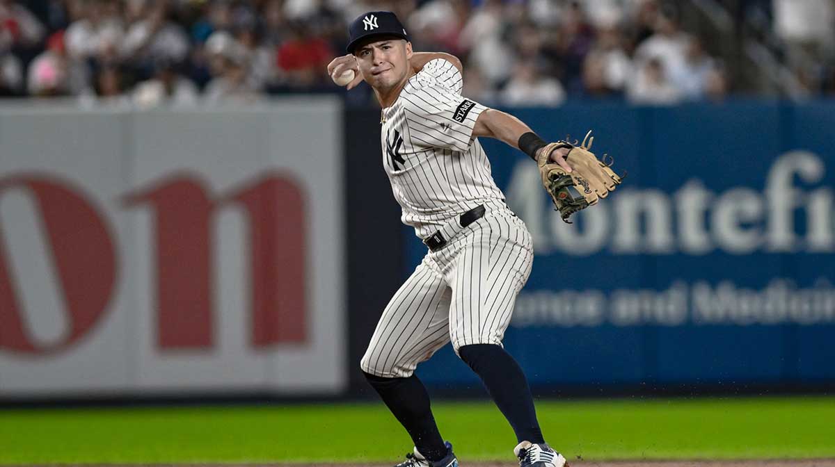 New York Yankees shortstop Anthony Volpe (11) fields a ground ball hit by third baseman Alex Bregman (2) and throws to first for an out during the eighth inning at Yankee Stadium. Mandatory Credit: John Jones-Imagn Images