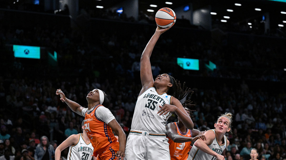 New York Liberty center Jonquel Jones (35) rebounds the ball against Connecticut Sun forward Aneesah Morrow (24) during the second half at Barclays Center.