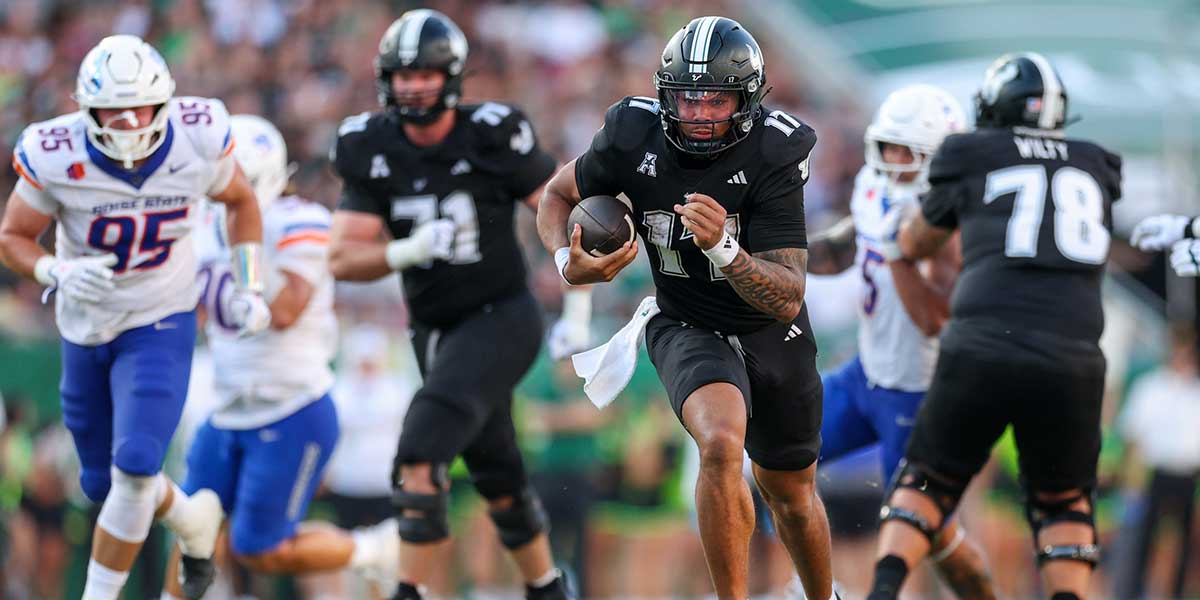 South Florida Bulls quarterback Byrum Brown (17) runs with the ball against the Boise State Broncos in the second quarter at Raymond James Stadium.