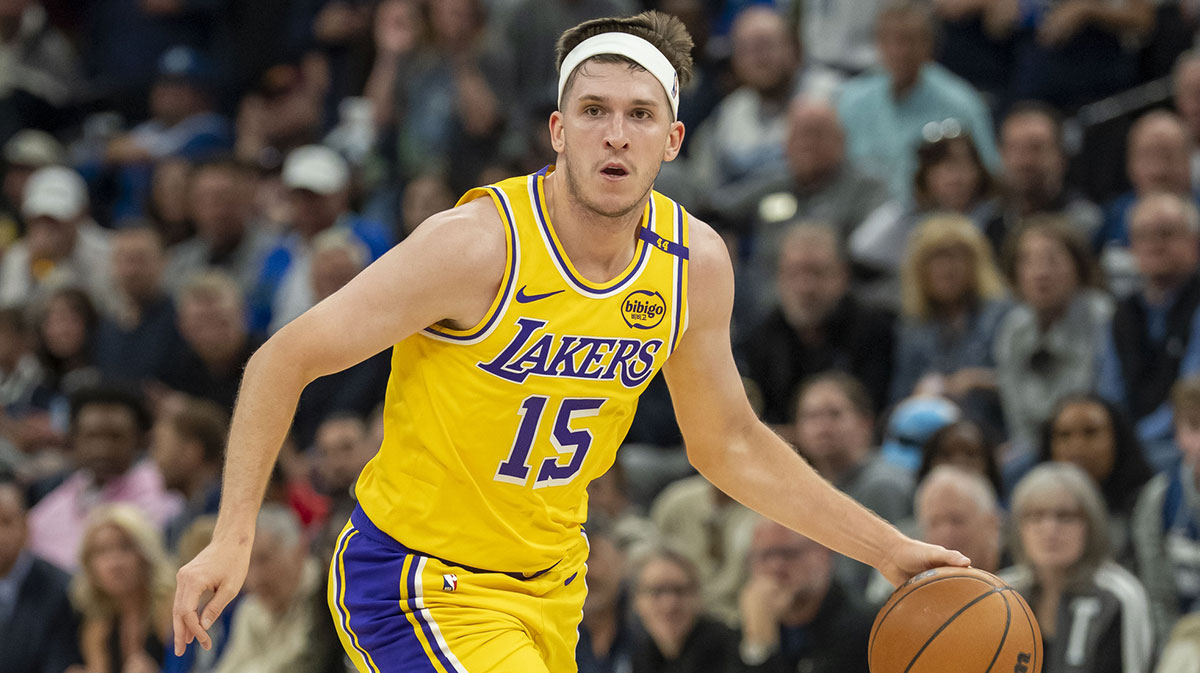 Los Angeles Lakers guard Austin Reaves (15) dribbles the ball against the Minnesota Timberwolves during game three of first round for the 2024 NBA Playoffs at Target Center.
