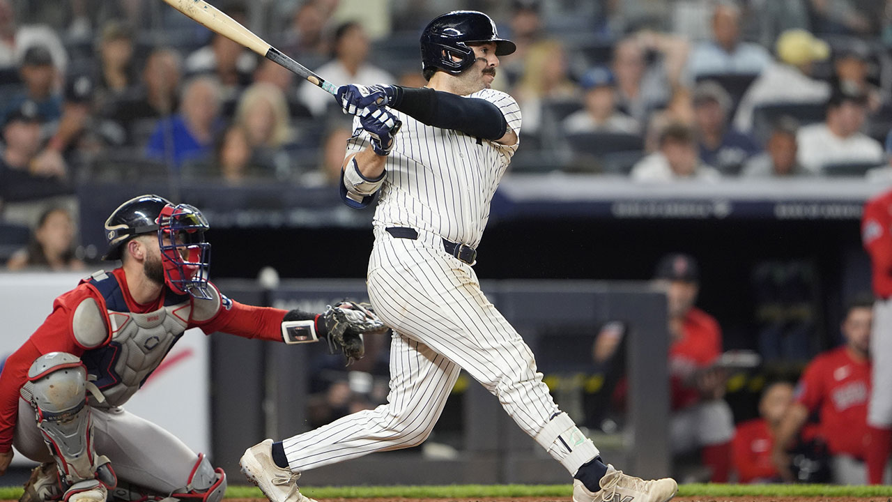 New York Yankees catcher Austin Wells (28) hits a single against the Boston Red Sox during the sixth inning at Yankee Stadium.