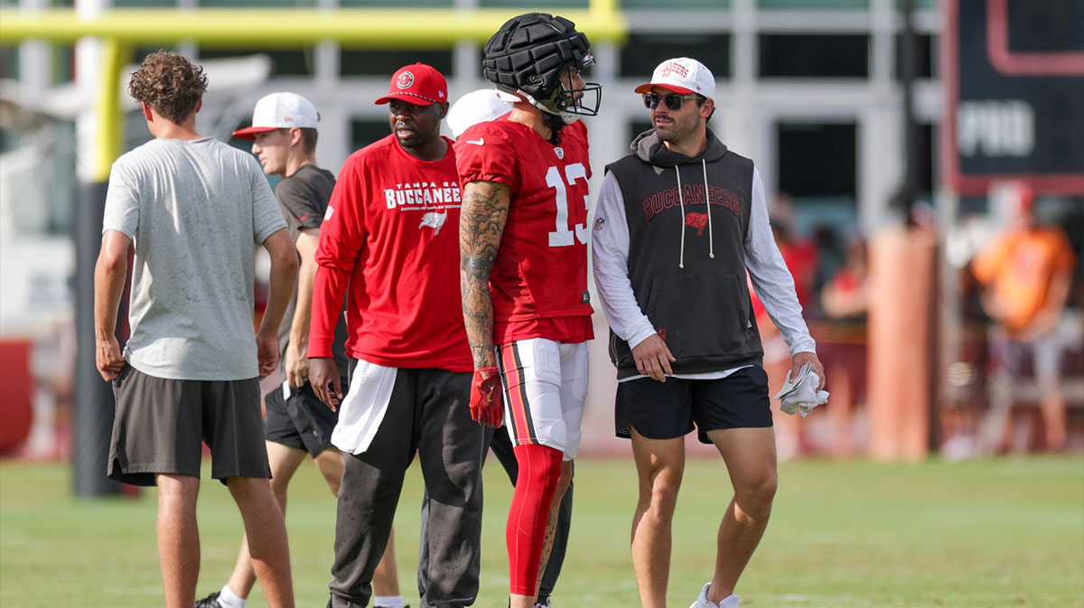 Tampa Bay Buccaneers quarterback Baker Mayfield (6) talks to wide receiver Mike Evans (13) during training camp at AdventHealth Training Center.