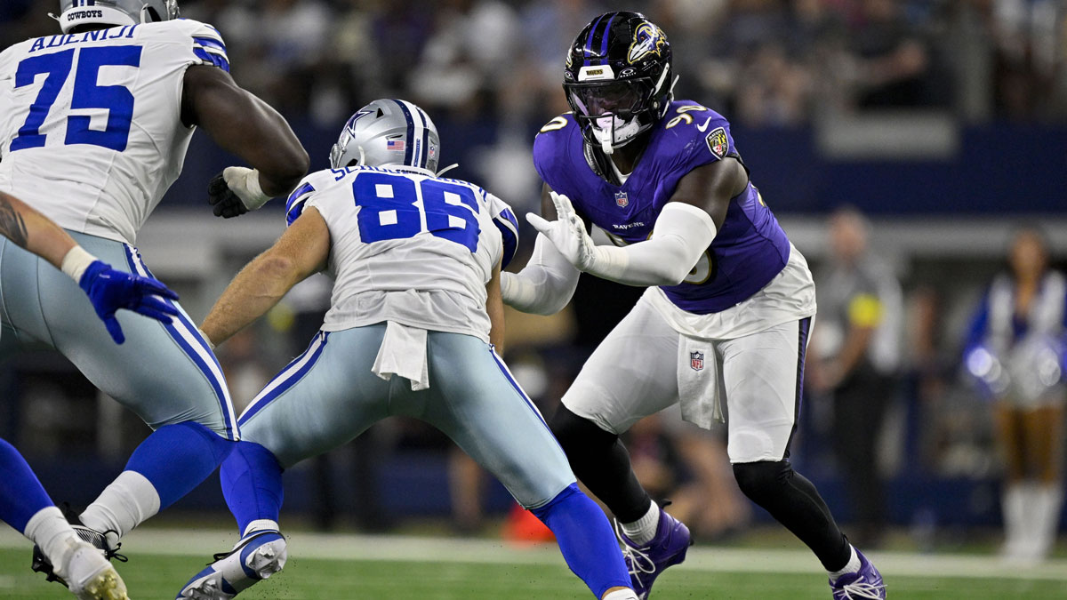 Dallas Cowboys tight end Luke Schoonmaker (86) and Baltimore Ravens linebacker David Ojabo (90) in action during the game between the Dallas Cowboys and the Baltimore Ravens at AT&T Stadium.