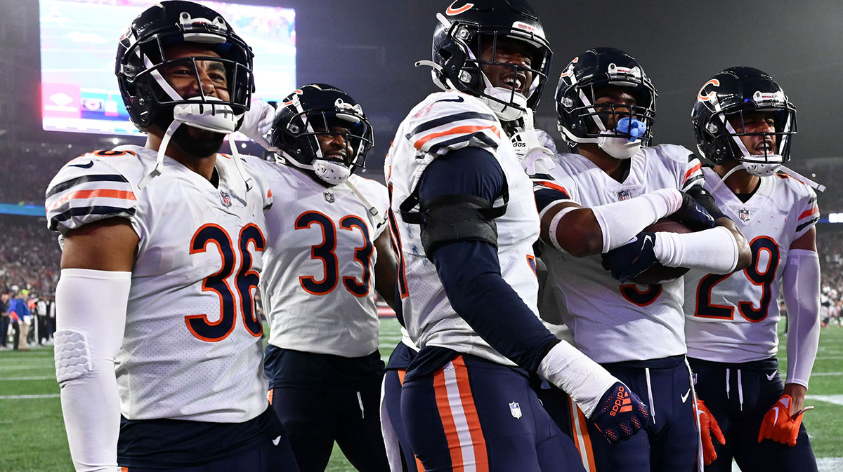 Chicago Bears safety DeAndre Houston-Carson (36), cornerback Jaylon Johnson (33), defensive end Dominique Robinson (91), safety Jaquan Brisker (9), and cornerback Dane Cruikshank (29) celebrate after an interception against the New England Patriots during the first half at Gillette Stadium.