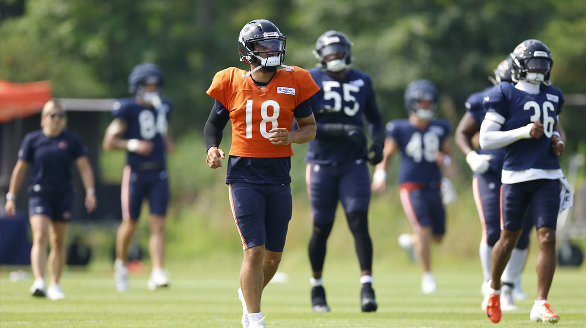 Chicago Bears quarterback Caleb Williams (18) warms up with teammates during joint training camp practice with the Buffalo Bills ahead of Sunday's preseason game.