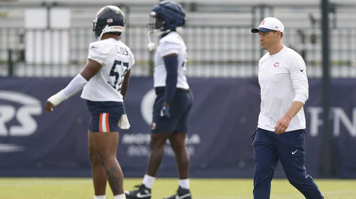 Chicago Bears head coach Ben Johnson walks on the field during training camp at Halas Hall.