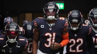 Chicago Bears cornerback Jaylon Johnson (1), safety Kevin Byard III (31 and safety Elijah Hicks (22) enter the field against the Jacksonville Jaguars during an NFL International Series game at Tottenham Hotspur Stadium.