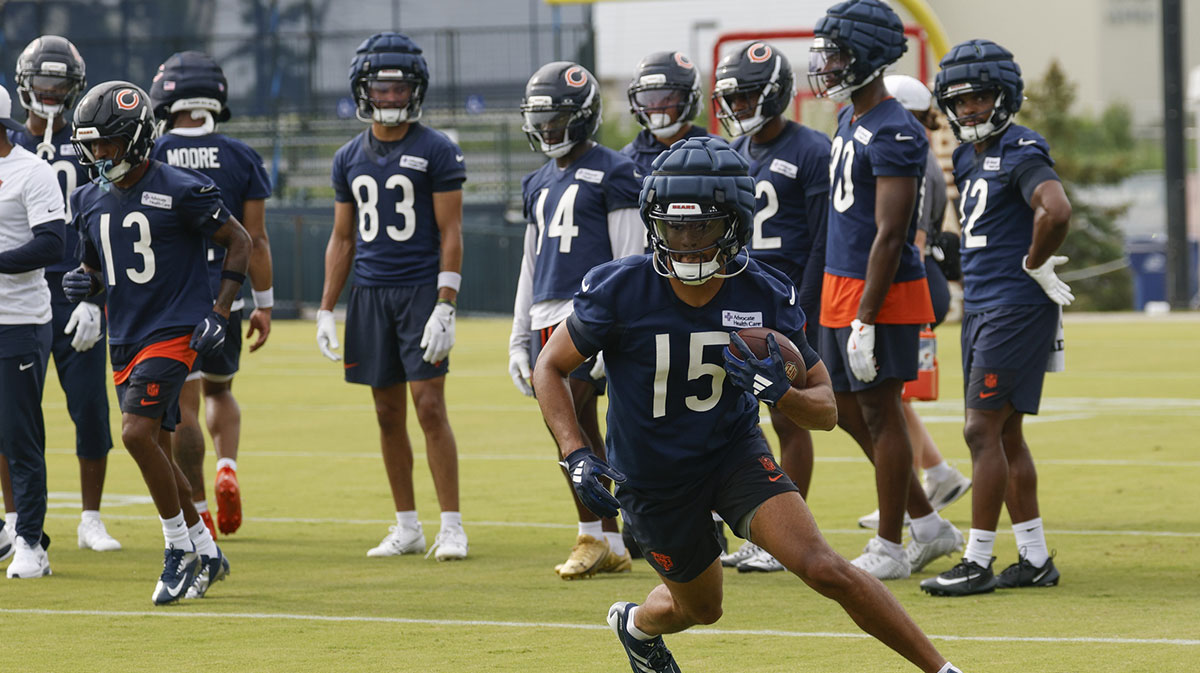 Chicago Bears wide receiver Rome Odunze (15) runs with the ball during training camp at Halas Hall.